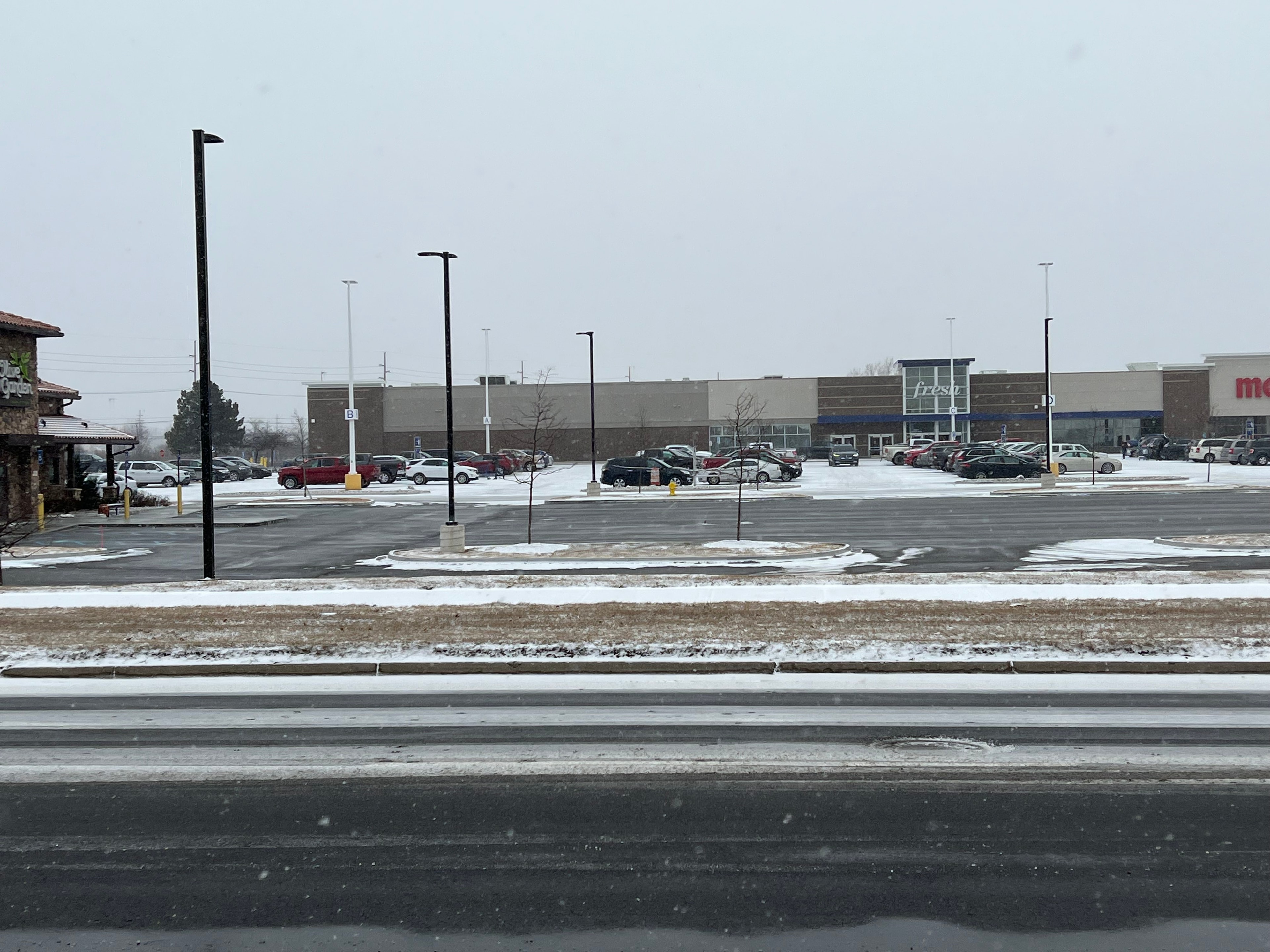 Snow-covered commercial property during a winter storm